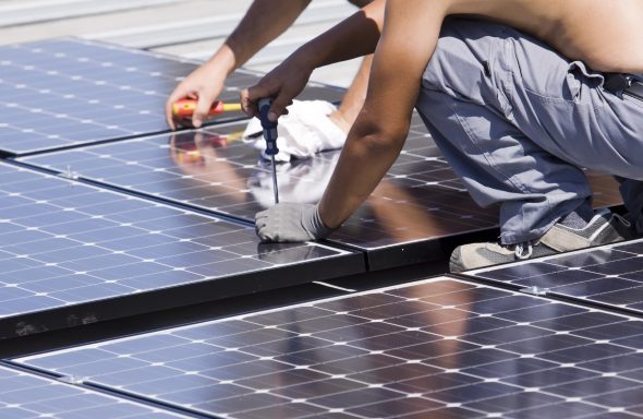 Installing solar panels on a roof